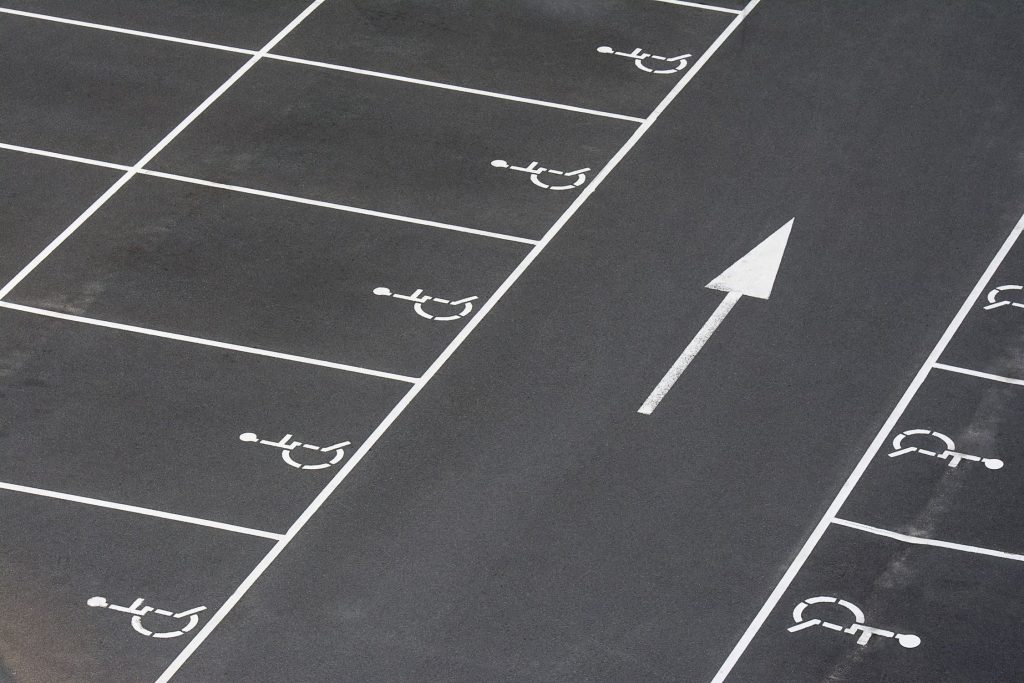 Directional arrow and accessible parking-space lines